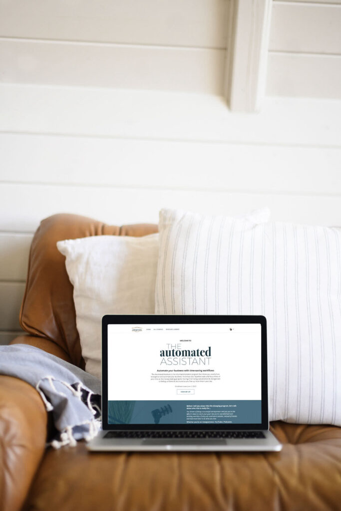 computer on sofa with The Automated Assistant Sales page